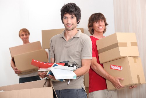 Moving team preparing furniture for a Bayswater flat removal