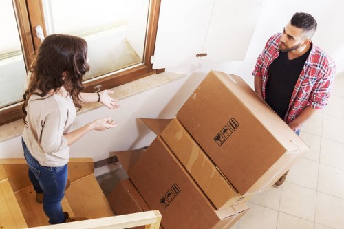 Staff assessing lifting risks before moving furniture